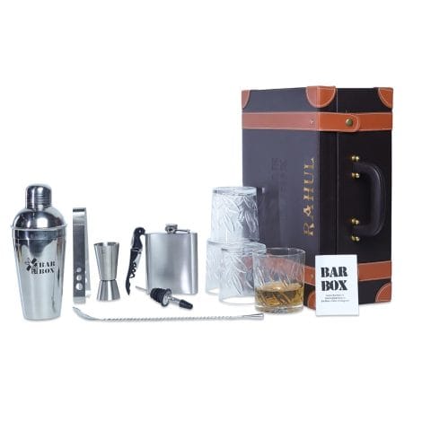 Portable bar set with whiskey glasses, cocktail shaker, and stainless steel bar tools. Ideal for home bar setup and decor. Includes wine opener and peg measure. Suitable for Indian consumers.