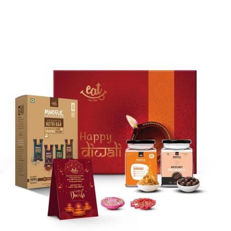 Premium Gift Hamper featuring Millet Bars, Hazelnut Protein Balls, Golden Raisins, and Beautiful Diya. Great Employee Gift!