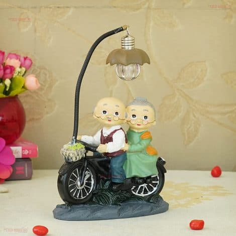 LED Light Statue Showpiece for Romantic Old Age Love Couple, perfect for home decor and gifting.