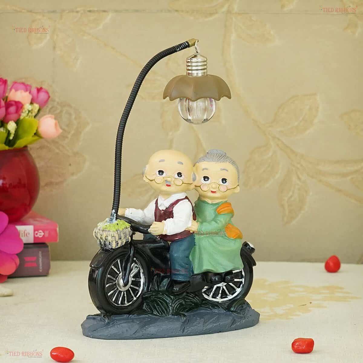 TIED RIBBONS Romantic Old Age Love Couple with LED Light Statue Showpiece for Home Decor Living Room Bedroom Table Wall Shelves Decoration Items Birthday Wedding