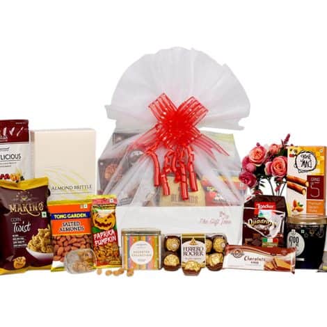 Premium Gift Hamper with a variety of herbal tea, snacks, and chocolates for corporate celebrations and special occasions.