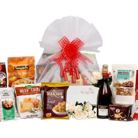 The Exclusive Gourmet Delight Basket with Juice, Dry Fruits, Nuts, and Naan Chips is perfect for any occasion in India.