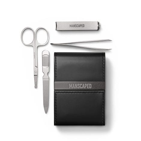 Compact luxury grooming kit for men with stainless steel nail tools and travel-friendly case.