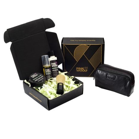 Luxury shaving set by Pink Woolf for Indian men, includes pre-shave oil, after-shave lotion, brush, soap, and leather bag.