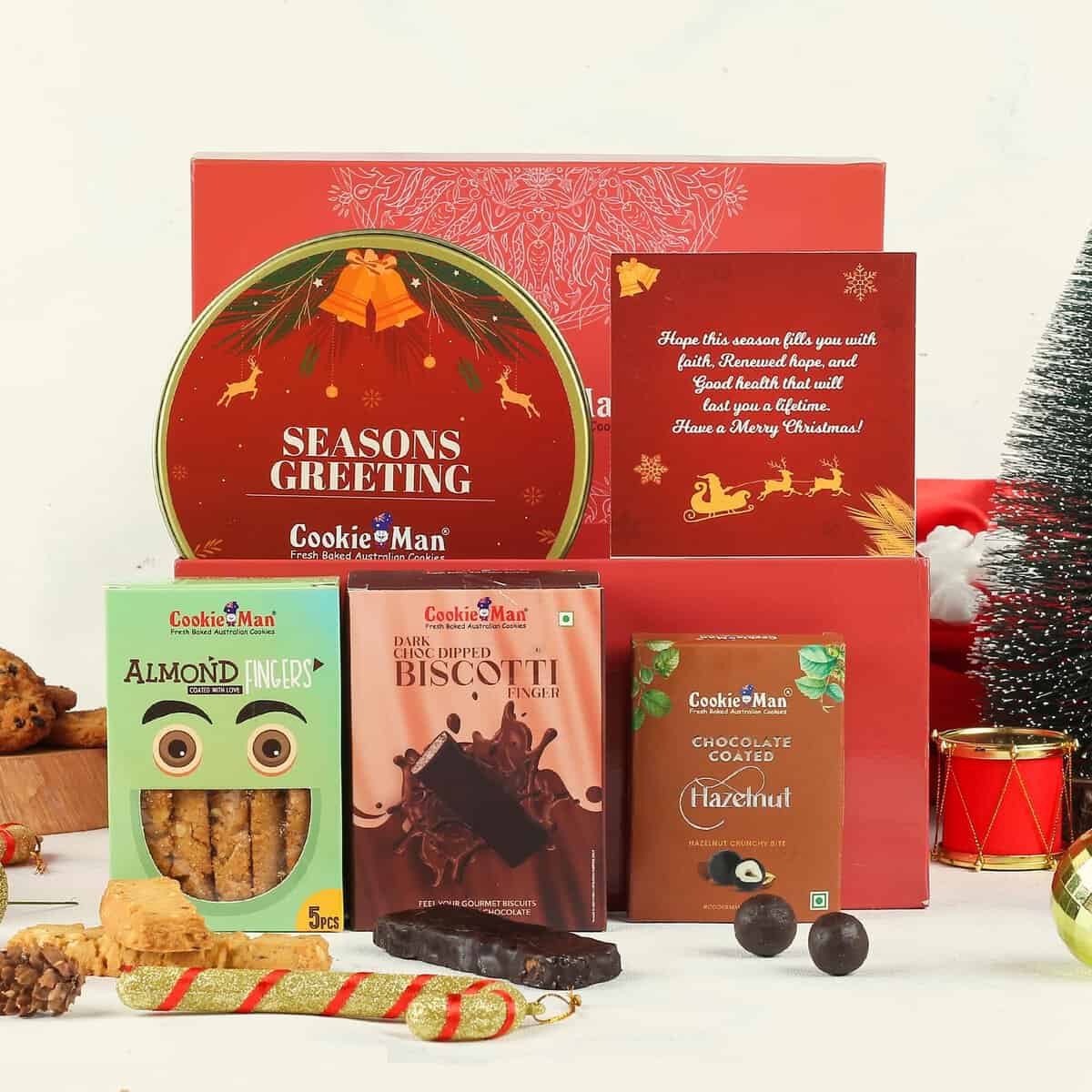 Cookieman Christmas Gift Hamper Box - 5 Christmas Gift Items Combo | Christmas Cookies and Chocolates Gift Pack |Chirstmas Cookies Gift Tin, Chocolate Dipped Almond Finger, Chocolate Coated Hazelnut, Almond Finger & Christmas Greeting Card