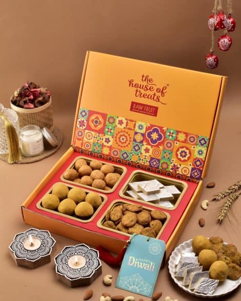 Diwali treats assortment: Gift pack of traditional Indian sweets, box, or hamper, perfect for family and employees. Includes Kaju Katli, Besan Laddoo, Kachori, and Diwali Candle.